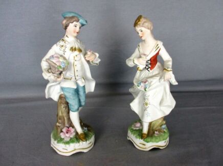 pair of Figurines Statues Bisque Porcelain Man and Woman Flower Boy Girl