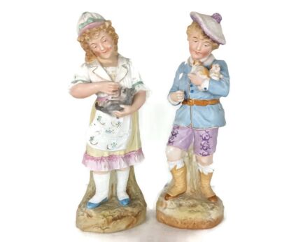 two statue figurines  porcelain  porcelain antique Germany boy puppies girl kitten