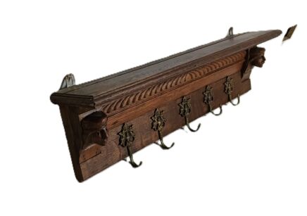 Ornate hand carved wooden antique smaller coat hanging rack Male figurine heads angel hooks